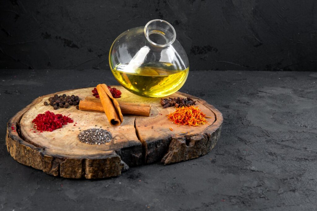 side-view-olive-oil-jug-with-spices-cinnamon-plate