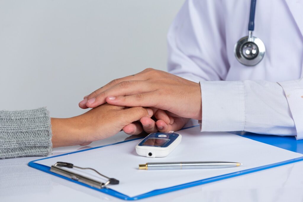 world-diabetes-day-doctor-holding-patient-hand